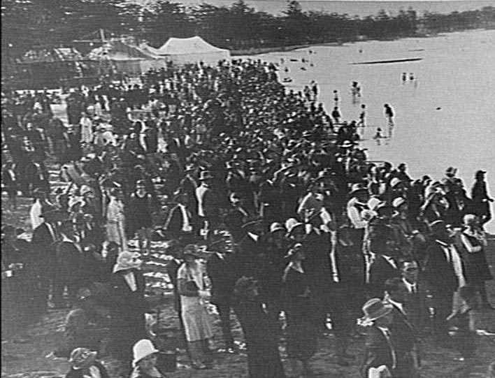 Crowds on Manly Beach, showing tents and other amusements