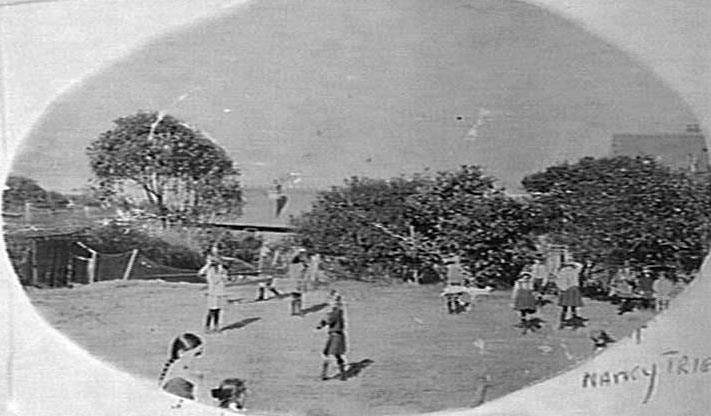 Children playing, possibly in a schoolyard