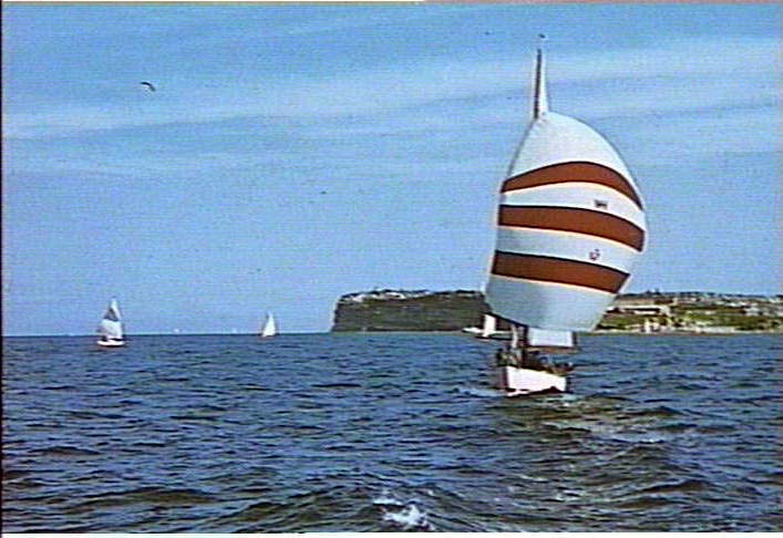 Yacht on Sydney Harbour, showing South Head in background