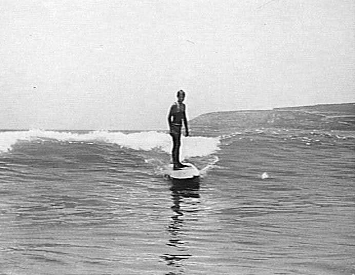 View of a young man surfing