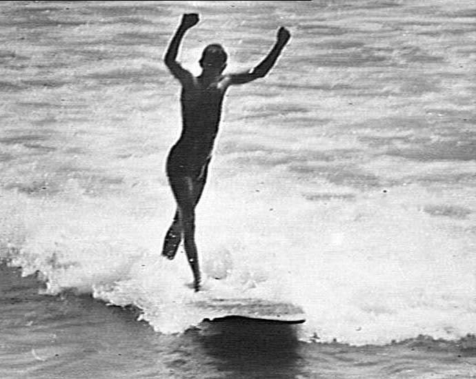 Man riding a surf-board, Freshwater Beach
