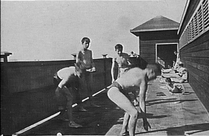 Unidentified boys playing at surf pavilion