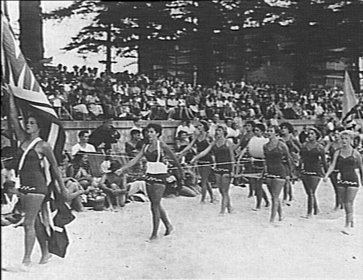 Manly female march past team