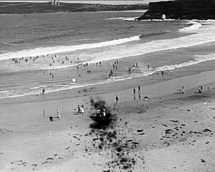 People swimming and walking at Freshwater Beach