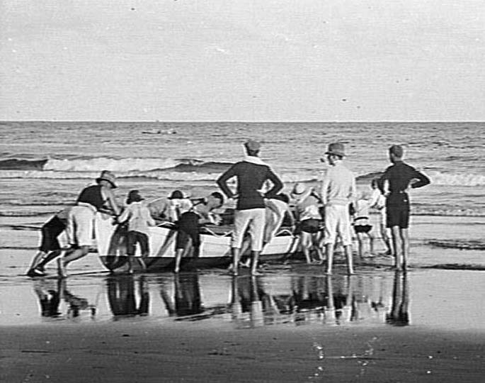 Launching a rowboat at Freshwater Beach