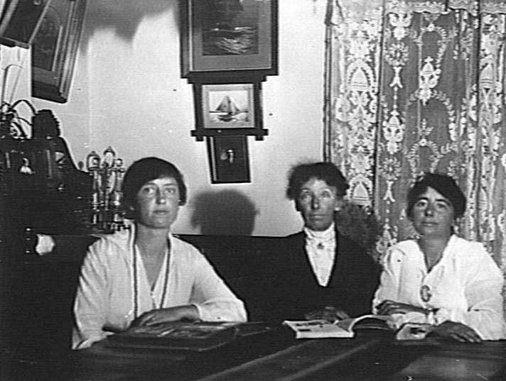 Three women inside a house in Wood Street, Manly