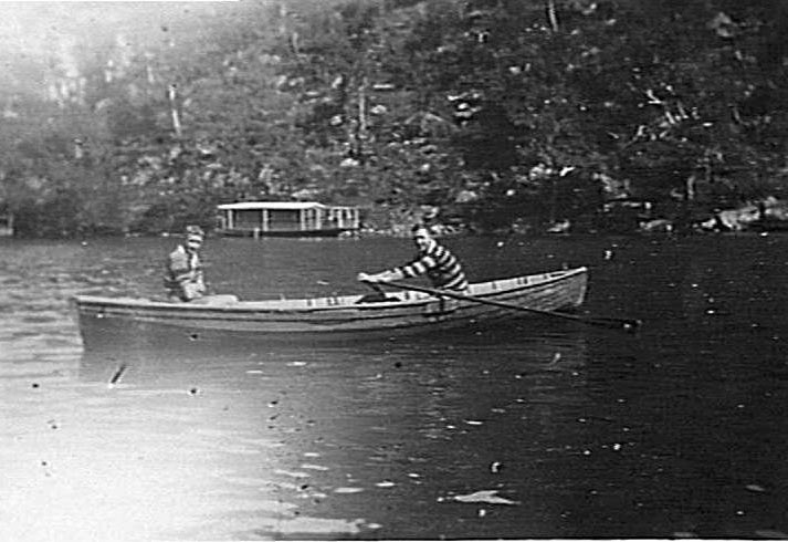 Two members of Manly Surf Club in a small boat on Cowan Creek