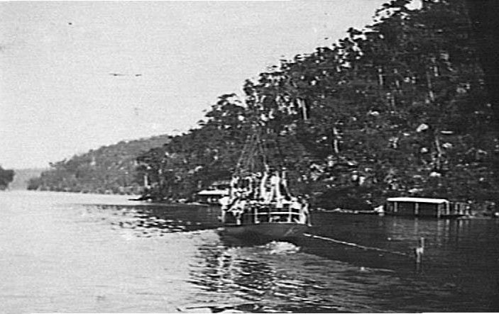 Part of Cowan Creek and district showing houseboats and large boat