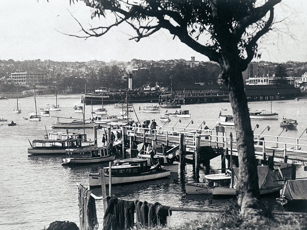Boats in Manly Cove preparing for a Venetian carnival