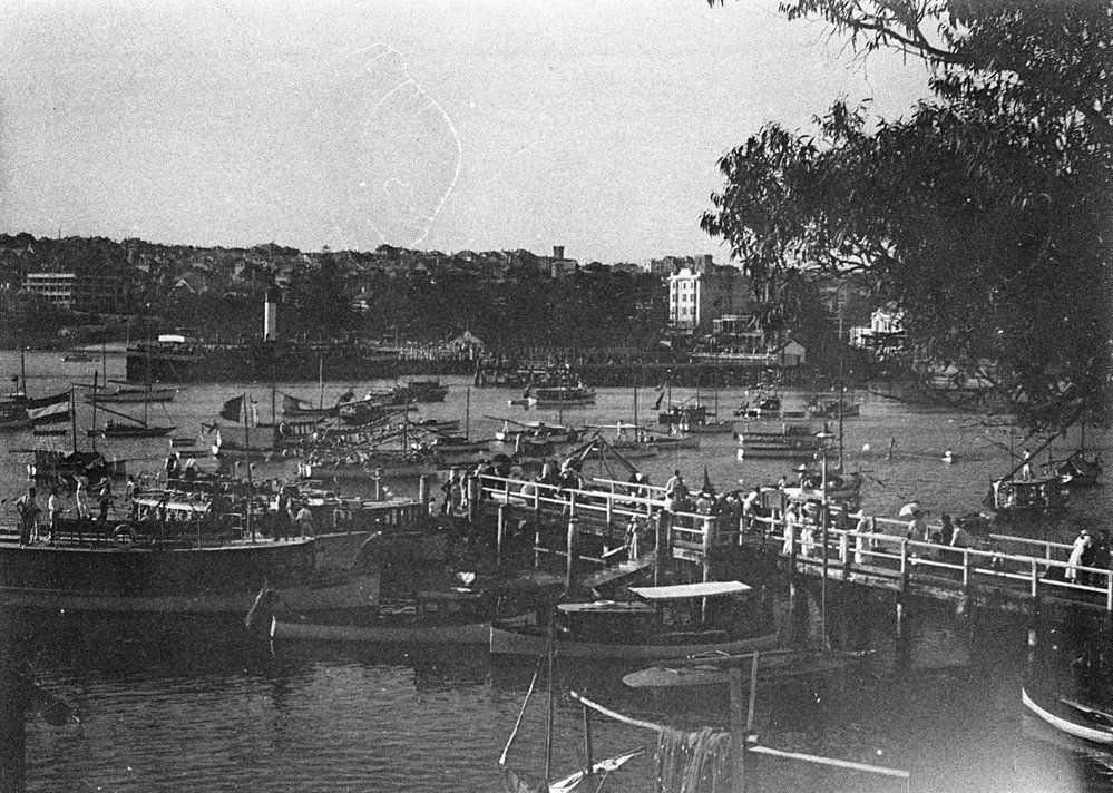 Boats on Manly Cove preparing for a Venetian Carnival