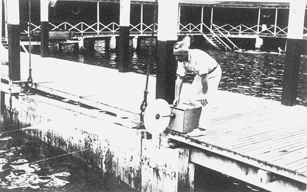 Clive Bell at Manly Baths, operating the swimming "Pacemaker"