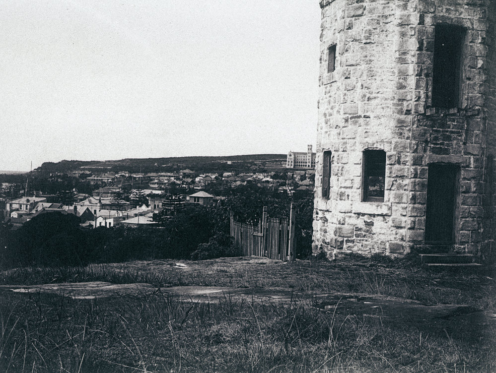Stone tower in front of Dalley's Castle, with view over Manly
