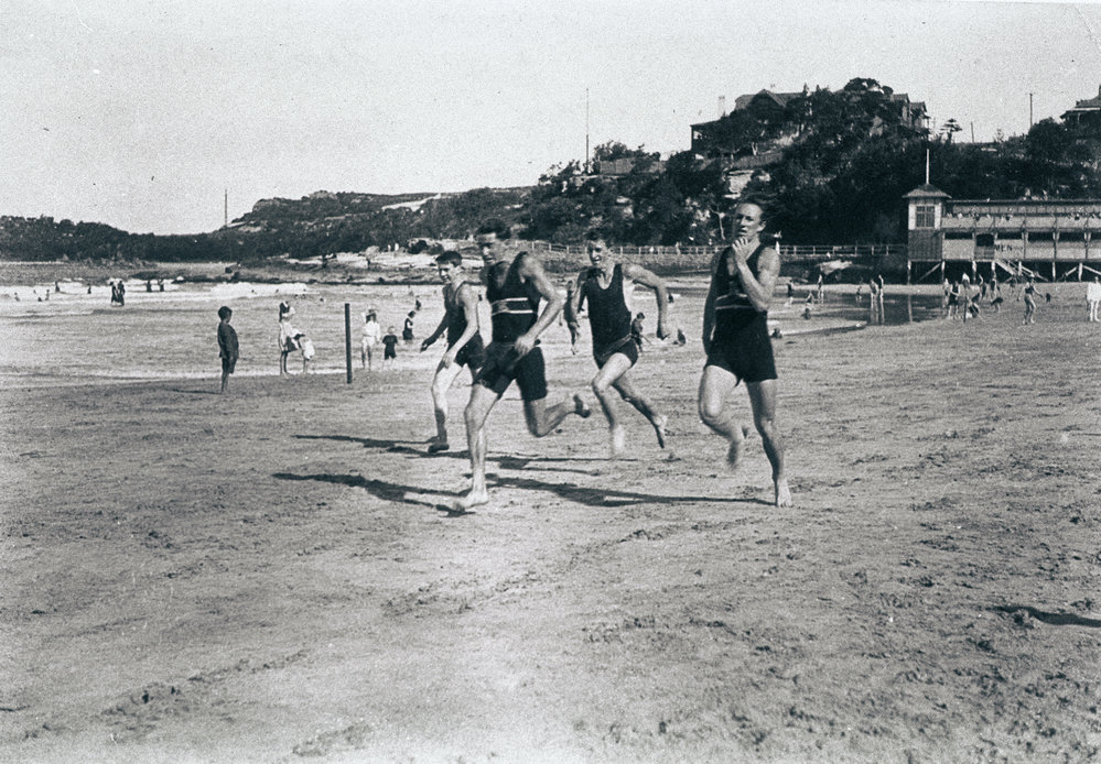 Surf lifesavers during a beach sprint on Manly Beach