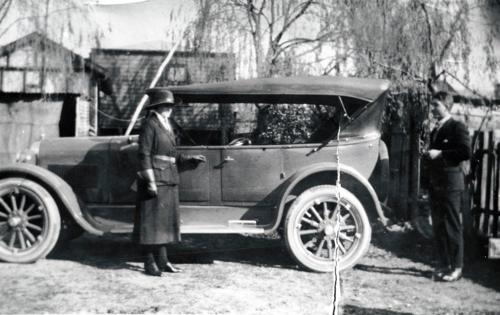 Iris Brimbecom and Robert Brown with a 1924 Dodge car, c 1930