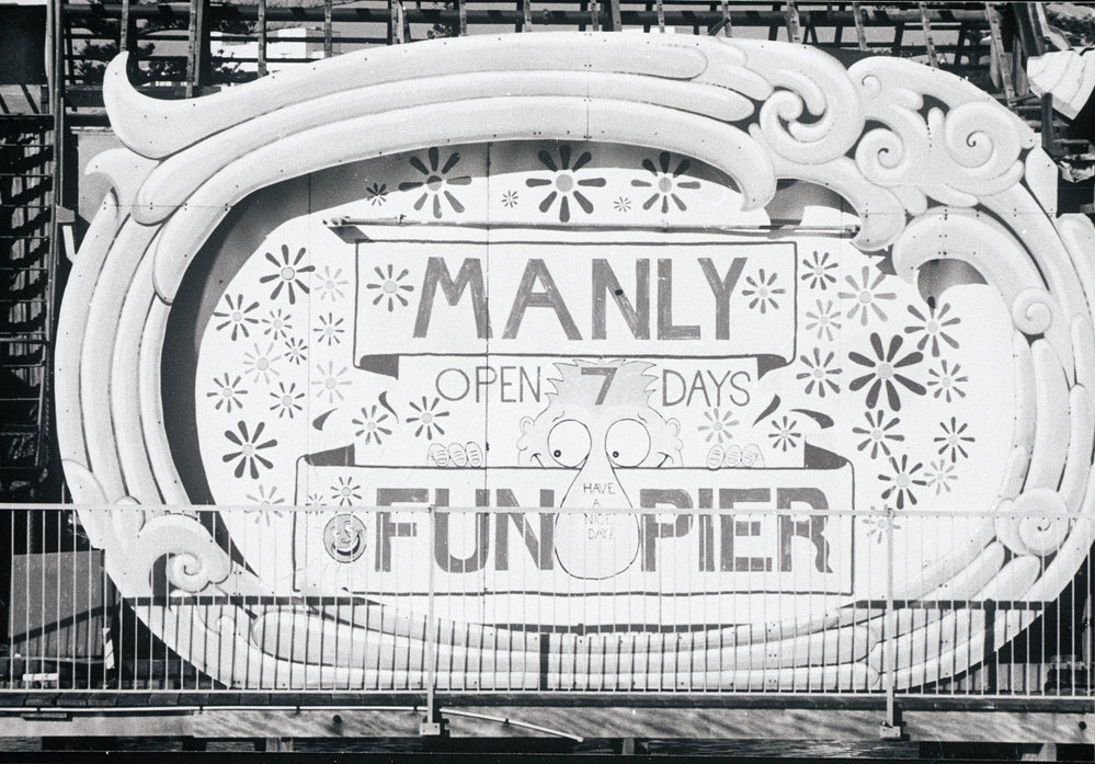 Hoarding for Manly Fun Pier prior to demolition, 1989