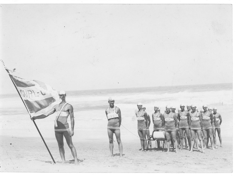 Members of the South Curl Curl Surf Life Saving Club march past team