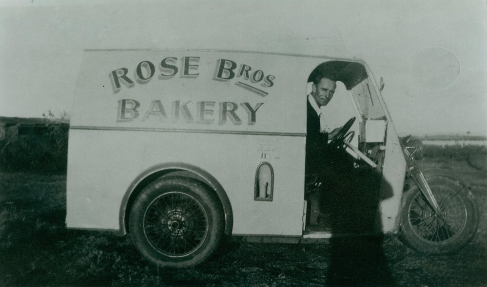 George Phillips driving the Rose Brothers' new three wheeler delivery van