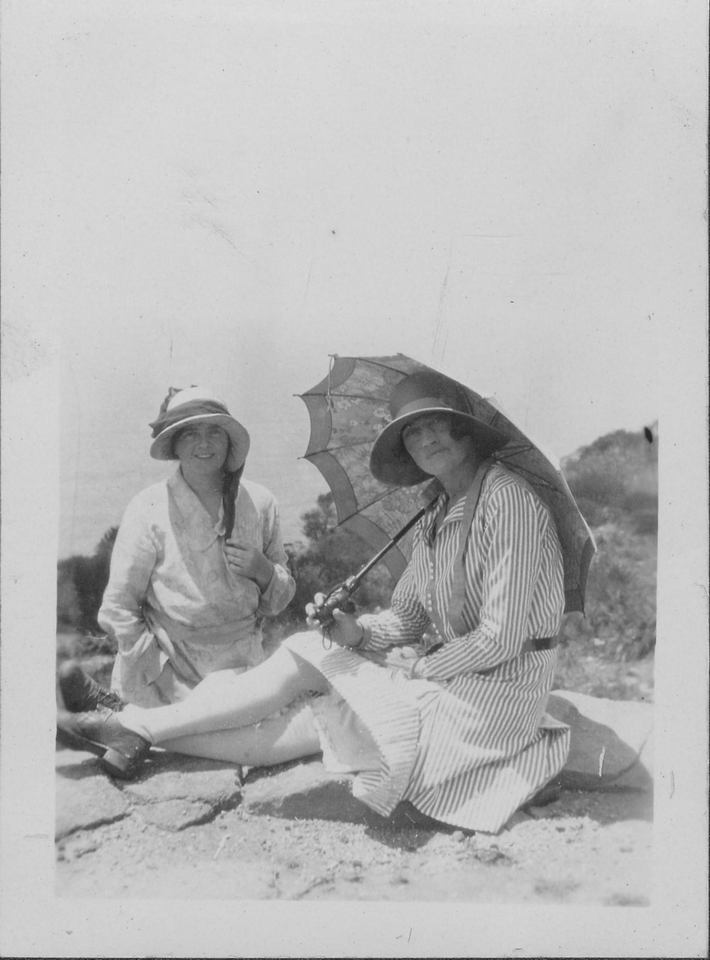 Two ladies sitting at Palm Beach, looks like Barrenjoey Headland, 1929