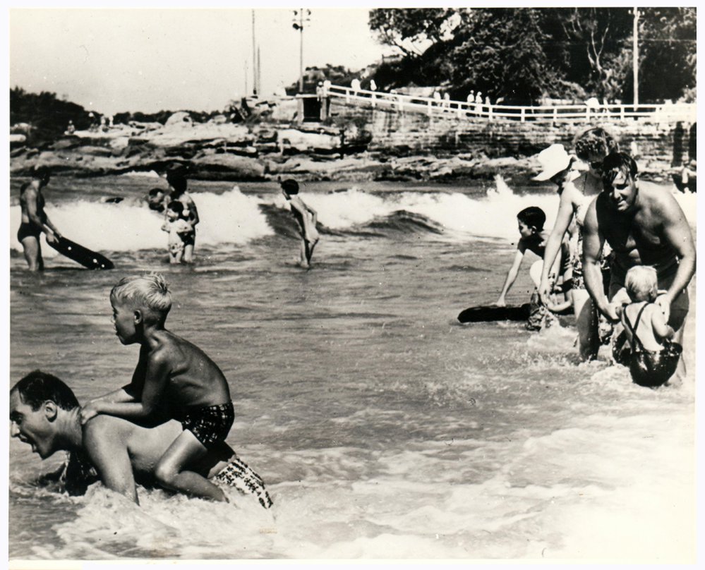 Unidentified people in the surf at South Steyne, Manly 1959