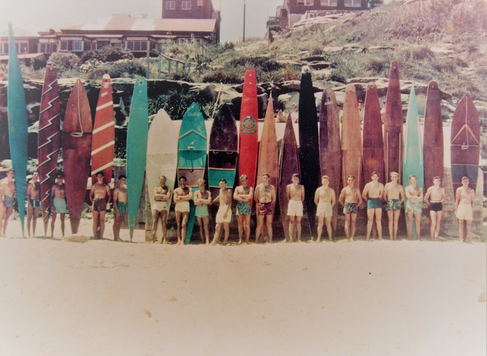 Group portrait of Surfers with wooden boards and skis, Queenscliff Beach