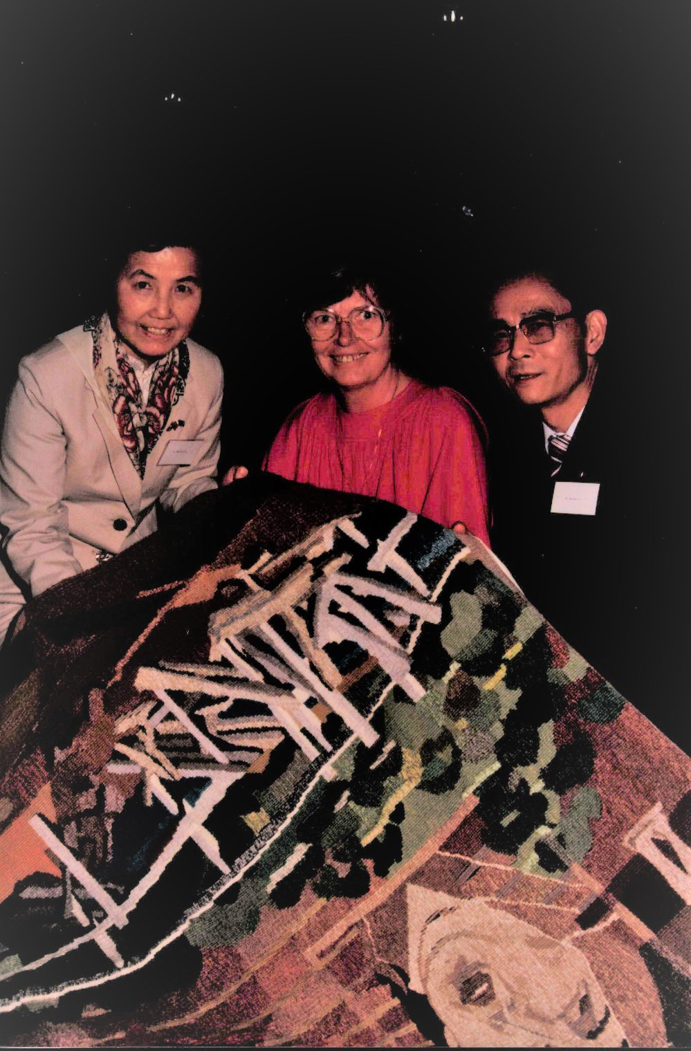 Examining Tapestry made by Forest Tapestry Workshop