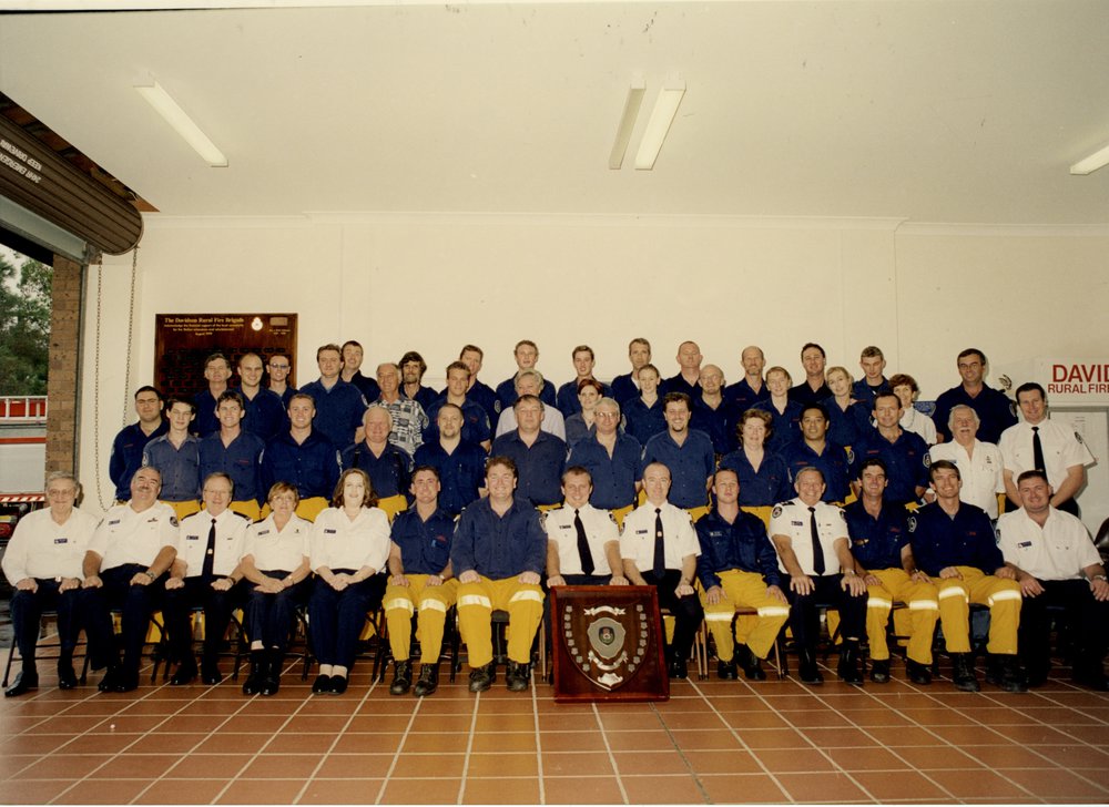 Davidson Rural Fire Brigade members with shield