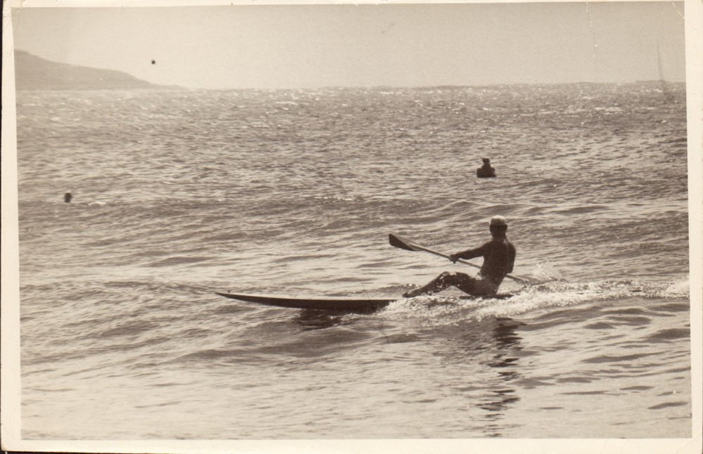 C.J. "Snowy" Mc Alister riding a surf ski at Manly, 1962