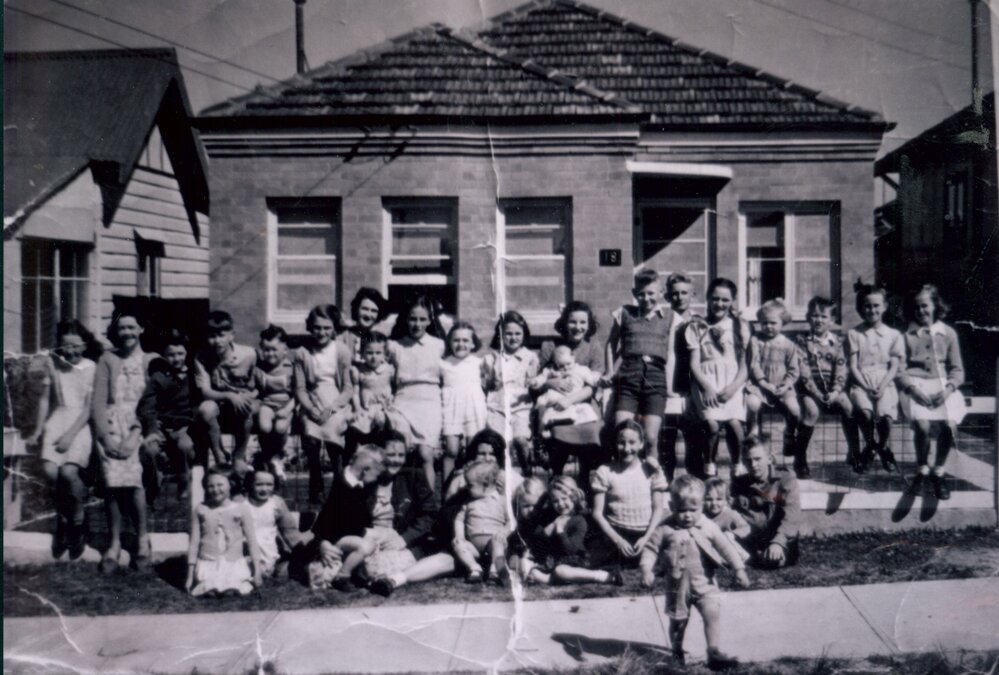 Group of children and mothers in front of 18 Johnson Street, Harbord