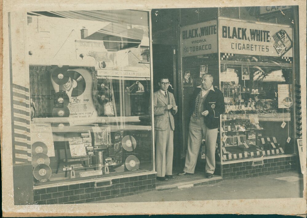 A.V. Robinson's tobacco shop in The Corso, with two people standing at the door