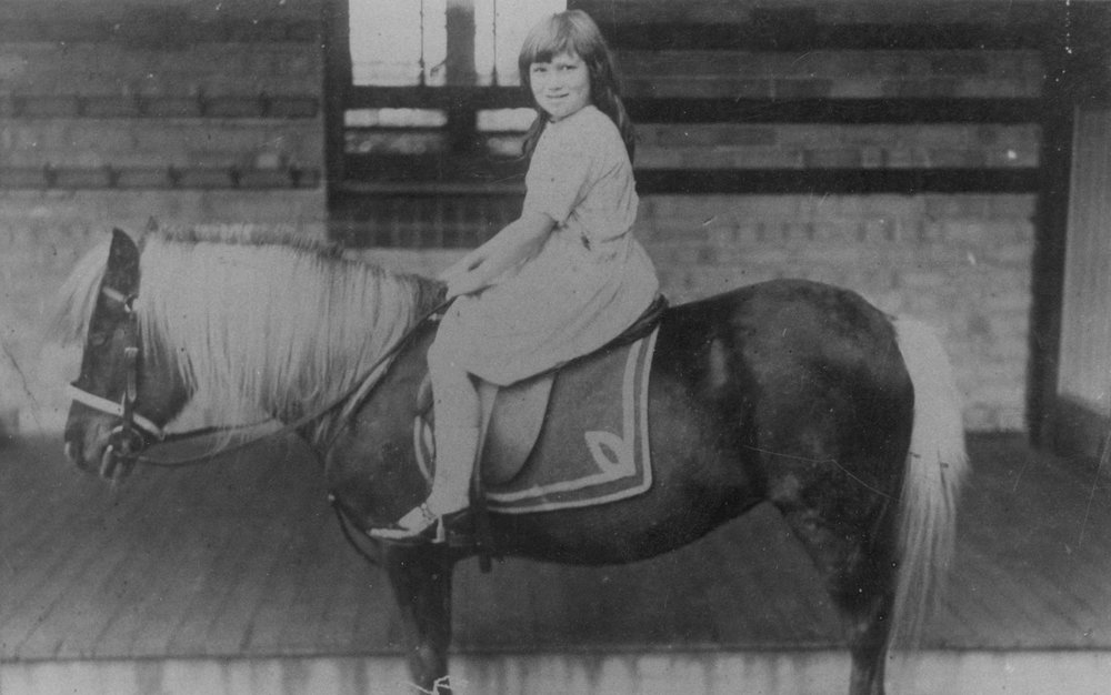Dorothy Miles in in front of a weathershed in Brookvale
