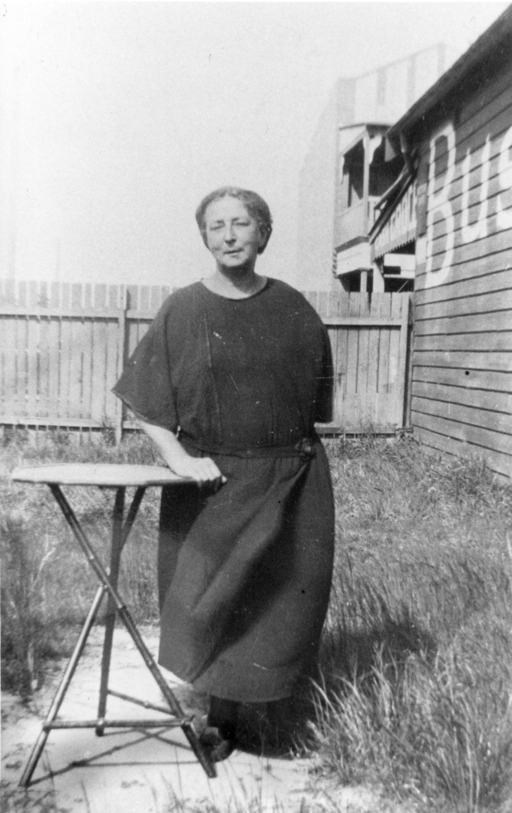 Mrs Langford outside the general store in Brookvale