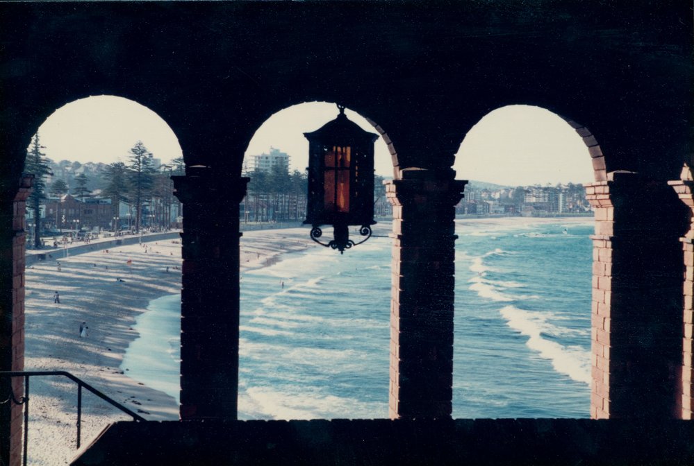 View north along Manly Beach, from the arch entry of the 1930 Borambil apartments, 1976