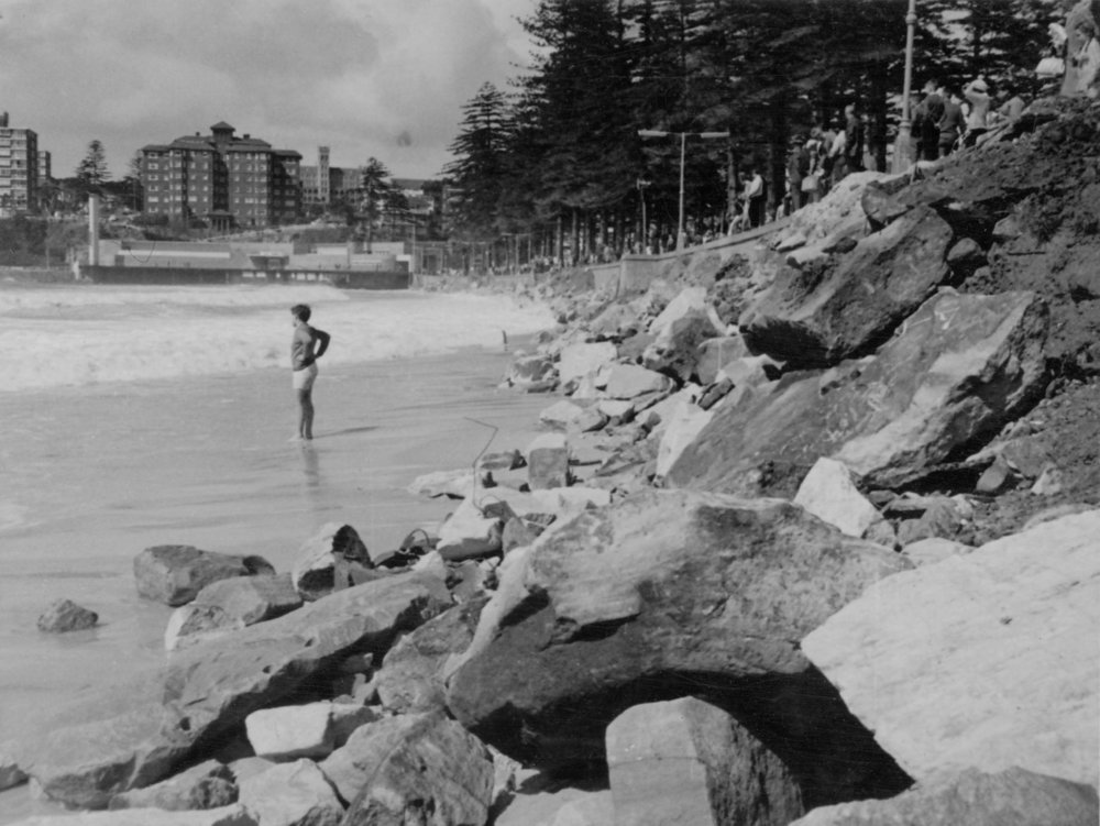 Manly sea wall breached by a storm, opposite Wentworth Street, Manly, c1960s
