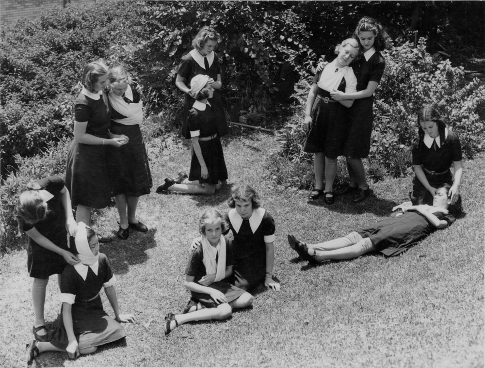 Manly Grammar School pupils in pairs demonstrating first aid, Manly, 1936