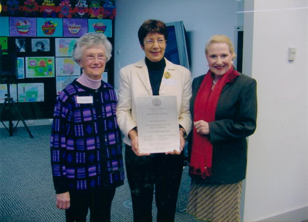 Mona Vale Library Official Opening by Pittwater Mayor holding plaque