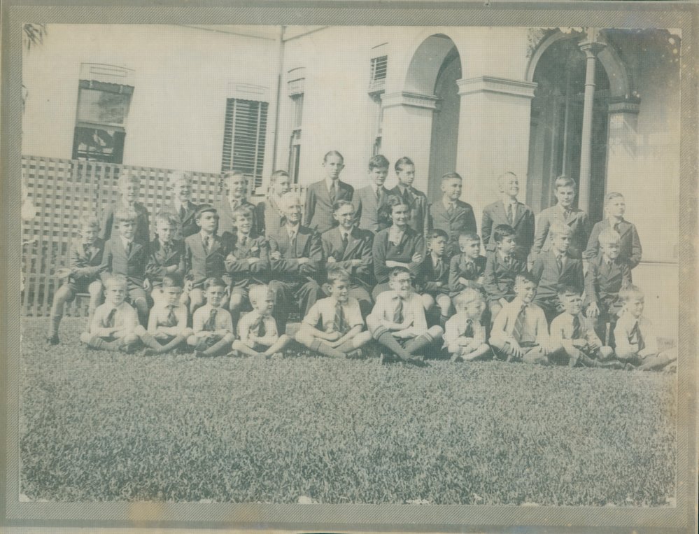 Group portrait of students and teachers, at an unidentified location and institution, c1930s
