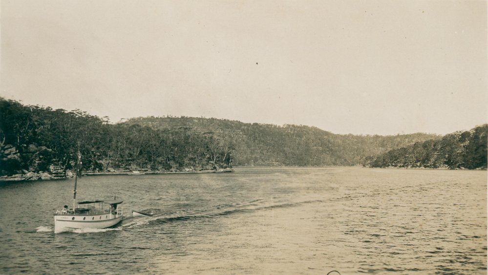 A boat with dinghy on Middle Harbour, possibly close to The Spit, 1926