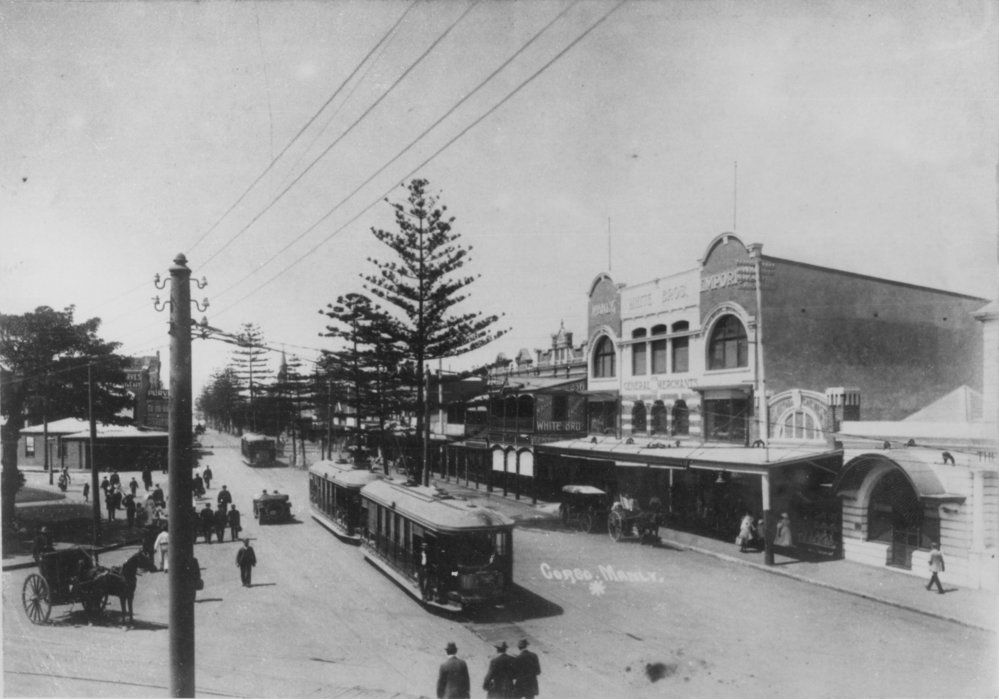View facing northeast from Manly Wharf along The Corso, showing Manly Emporium, Manly, c1913