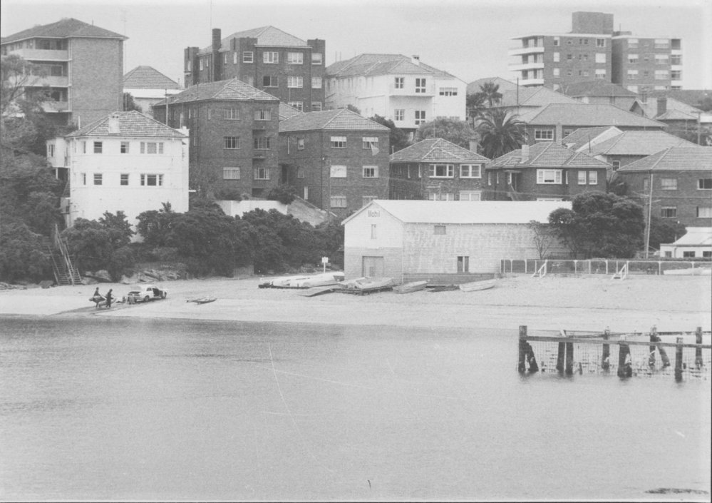 Residential flats, the beach and baths at Little Manly Cove, c1970s
