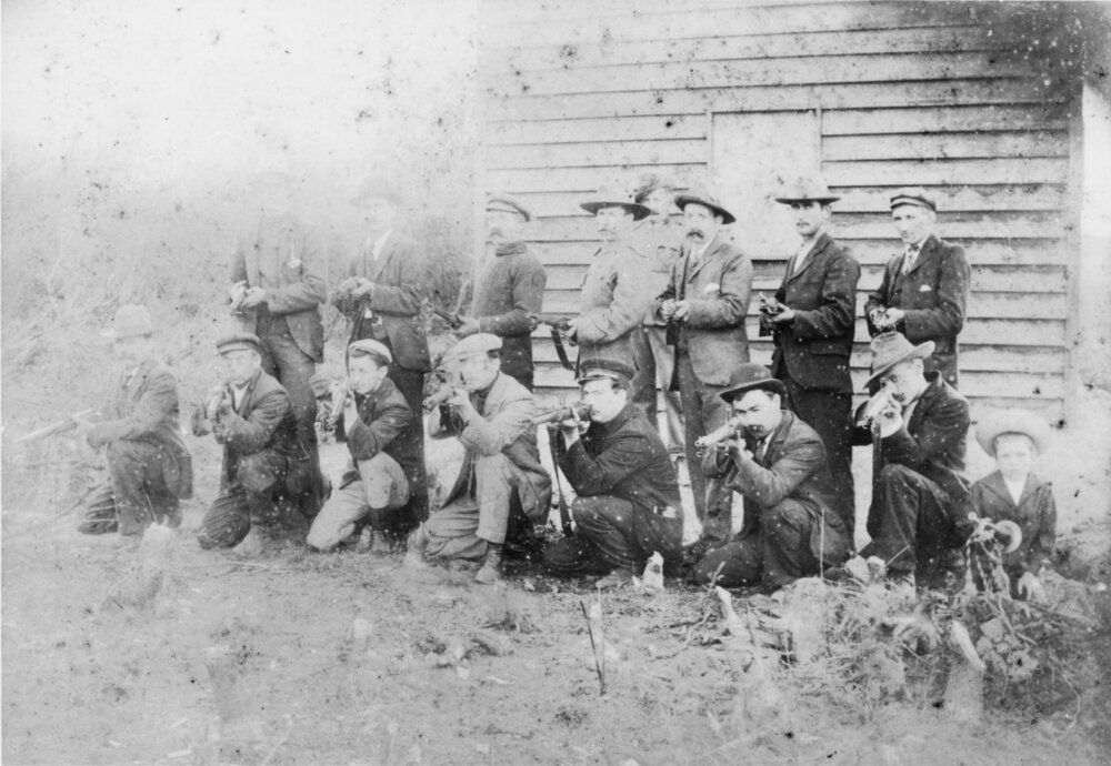 Group portrait of 15 non military riflemen, early 1900s