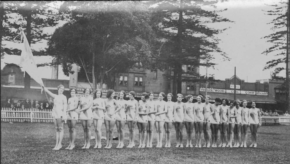 Group portrait of twenty-one women in costume at Manly Oval, Manly, c1930s