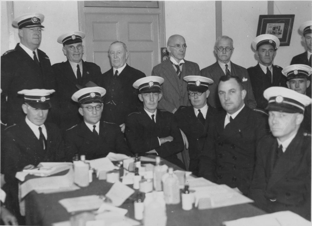 Group portrait of Superintendent Davey and unidentified ambulance officers, Manly Ambulance Station, Raglan Street, Manly, c1934 to 1938