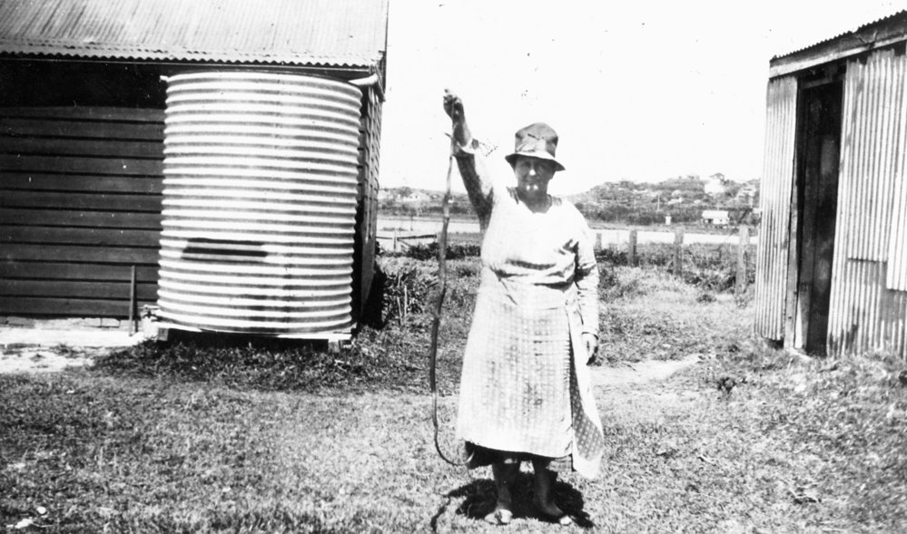 Mary Elisabeth (Lizzie) Sayce with snake on their farm Abbott Road North Curl Curl