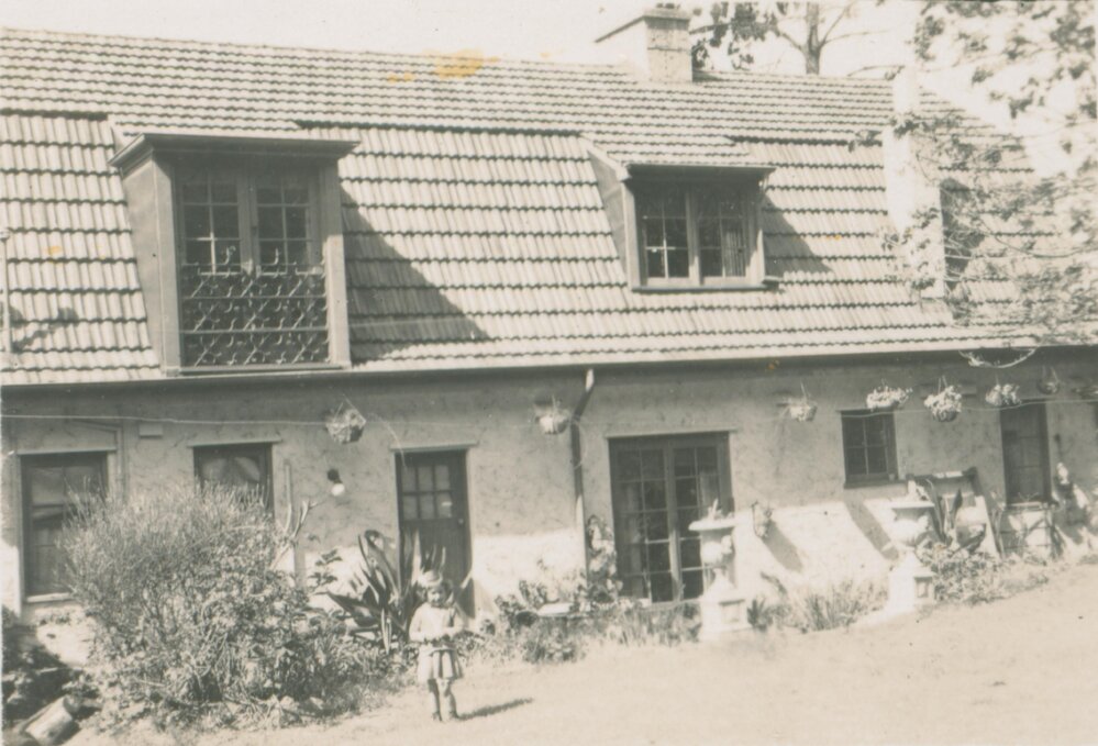 Child in garden of Koala, Bayview.
