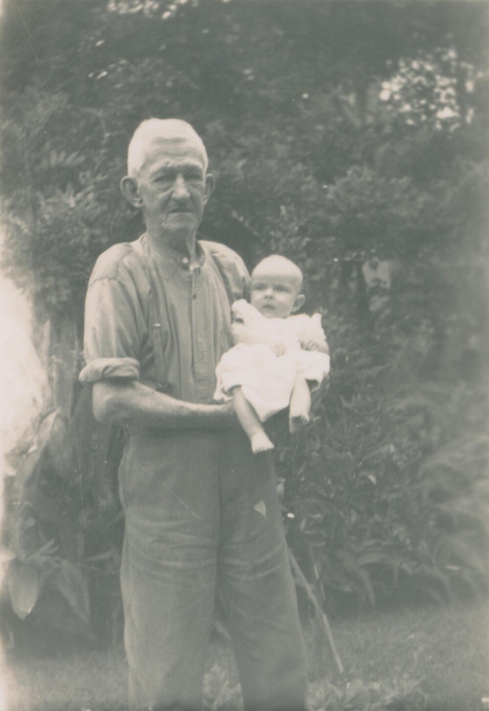 James Ireland holding his grandson, Fairlight.