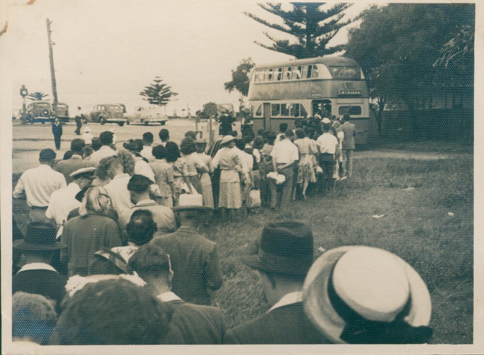 People queuing for bus at Palm Beach, c 1940