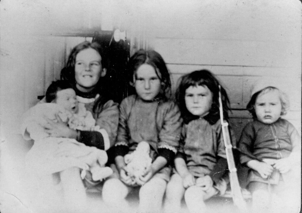 Five of the Randell family children outside Randell's store, Freshwater