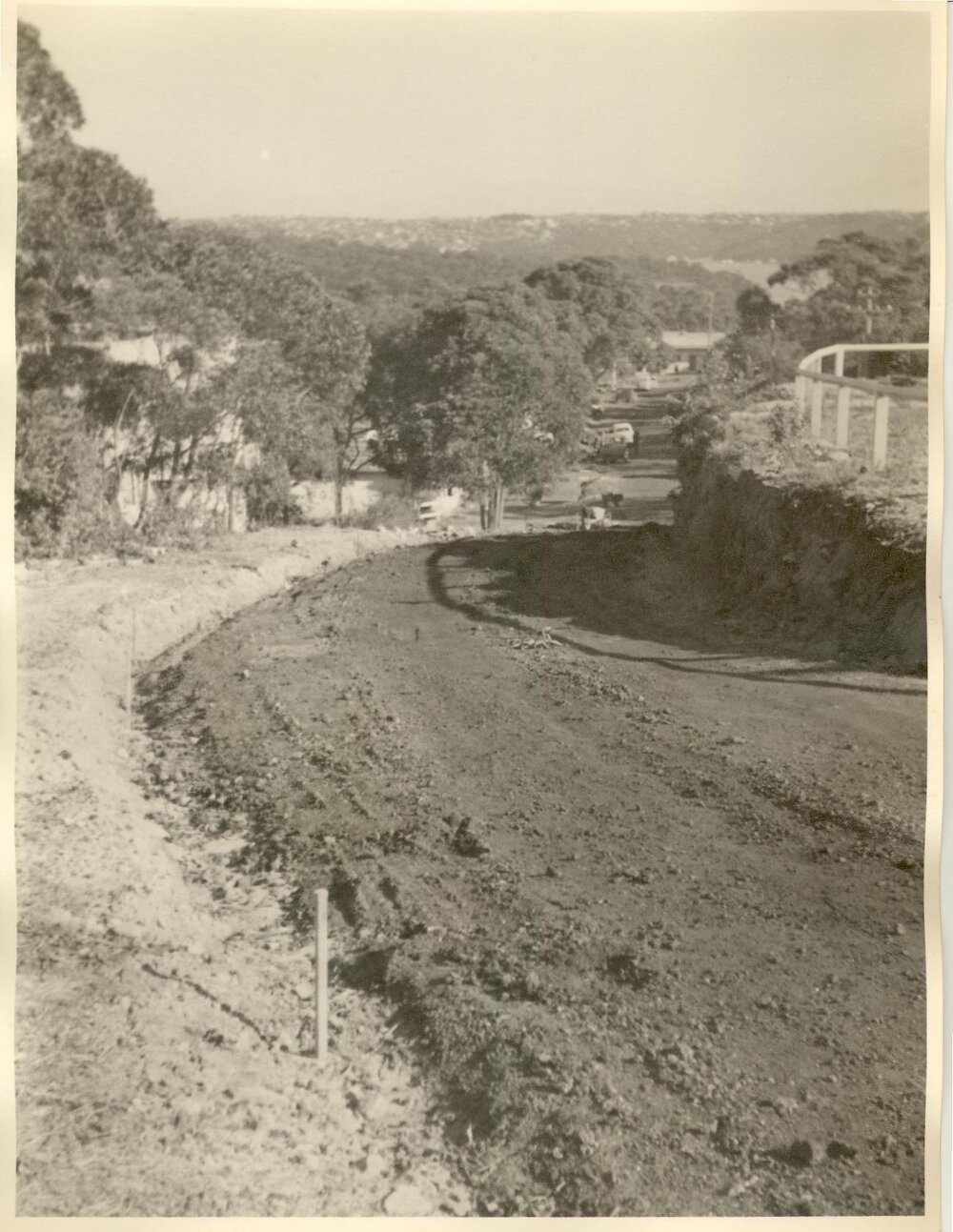 View down unsealed road Moore Street, Clontarf, June 1955