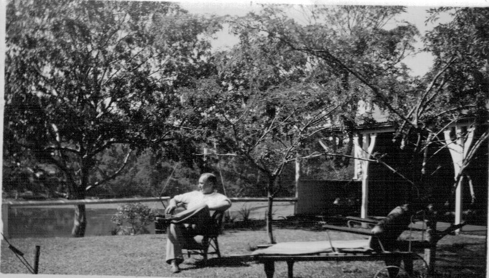 Mr Douglas sitting in yard of Mona Street house, Mona Vale 1947