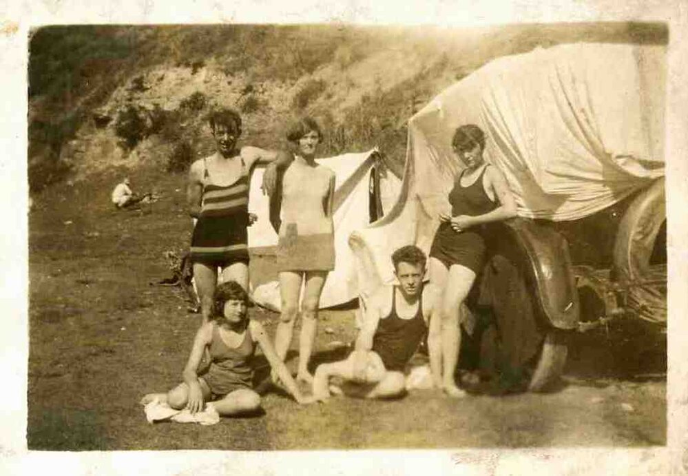 Nancy Wooldridge standing in centre, Walter Carpenter sitting at right at Newport Beach